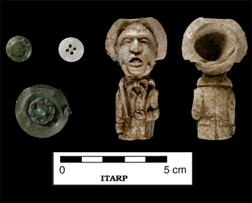 Buttons, pendant, and pipe bowl recovered from F26.